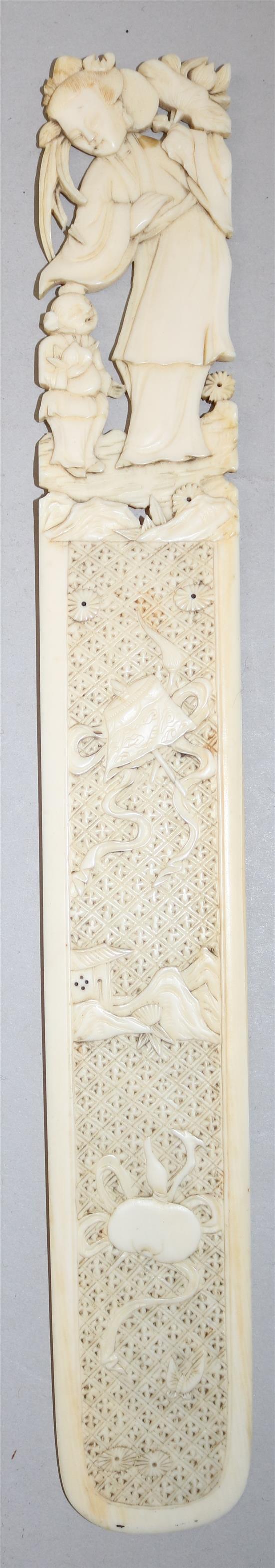 A Chinese export ivory page turner and a similar panel, late 19th century, 30cm and 10.5cm